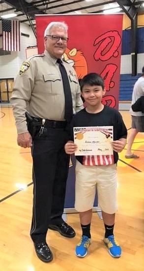 Sheriff with HHS school essay winner Andrew Nguyen BLOG.jpg