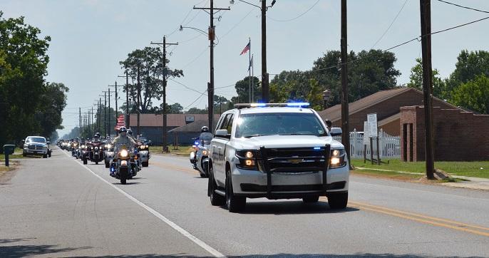 Deputies escort flag through parish.JPG